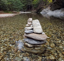 A peacefull image of rocks in a stream of flowing water